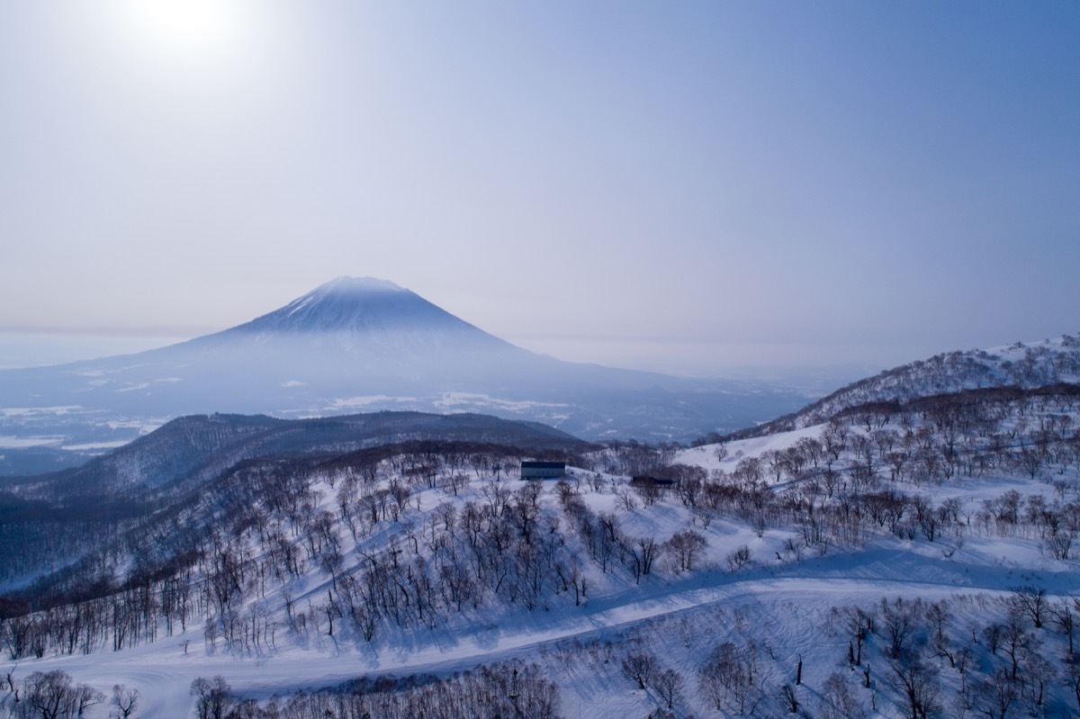 aerial view of the park hyatt hanazono with mt. yotei in the background