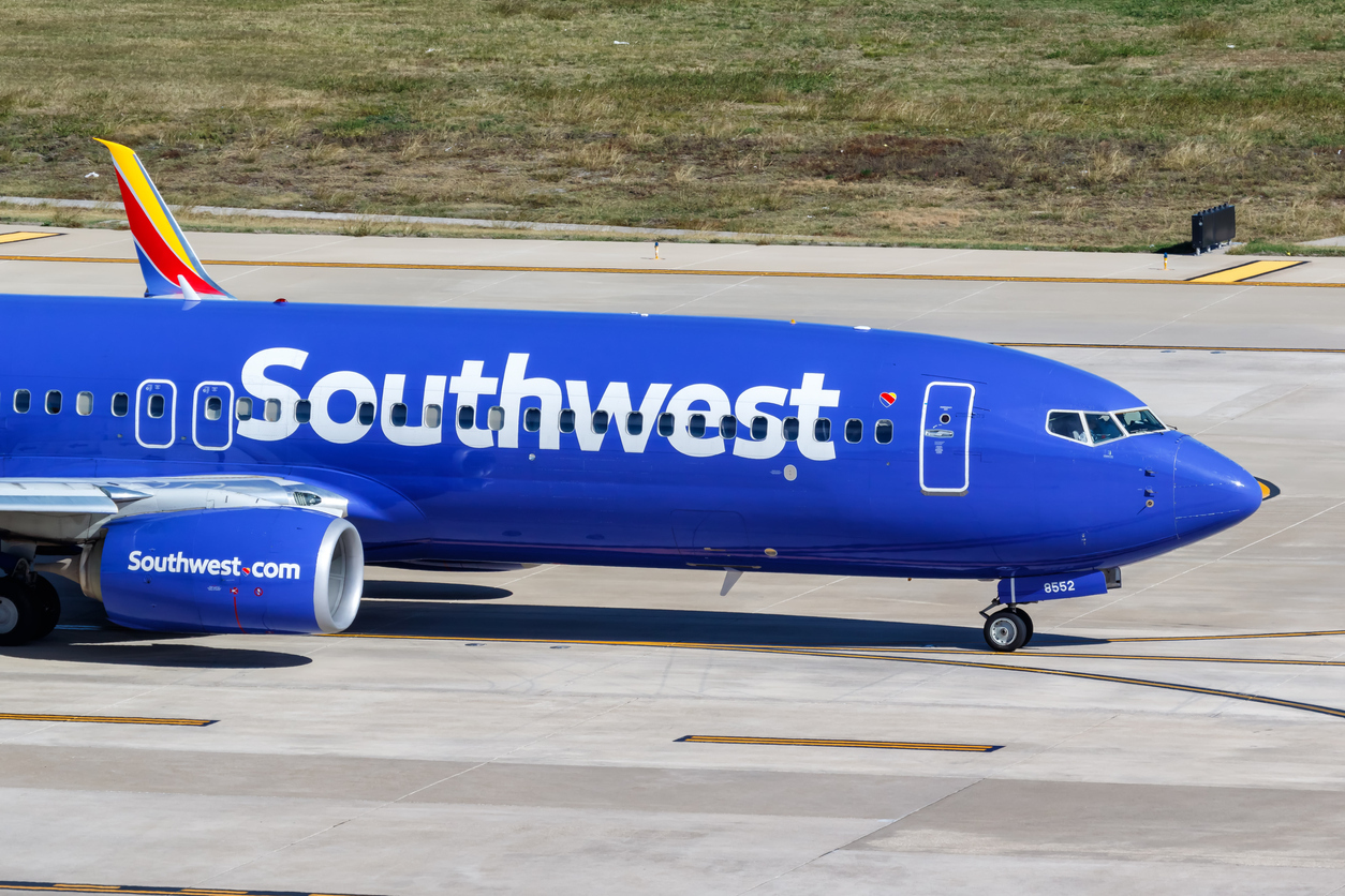 A Southwest plane taxiing on the runway