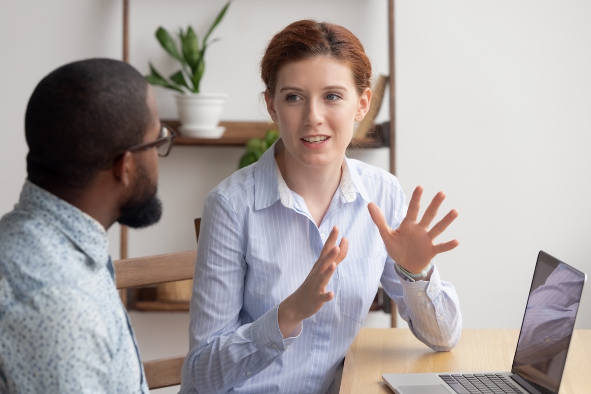 interracial coworkers talking at work