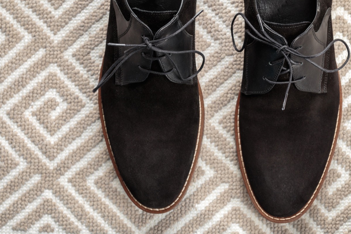 suede shoes on a patterned rug