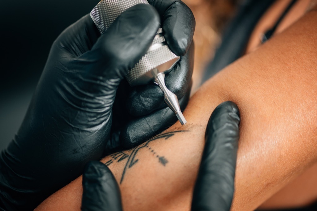 man getting a tattoo