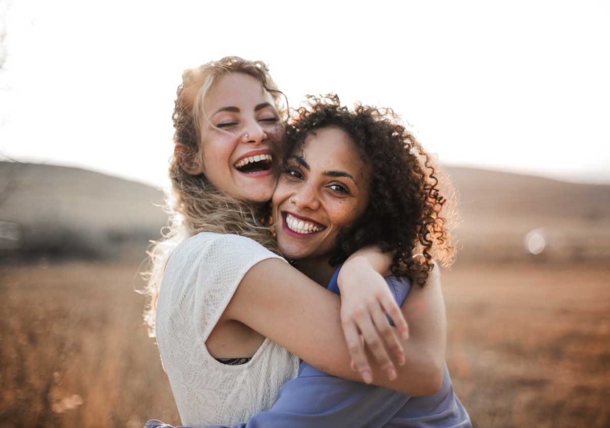 two female friends hugging