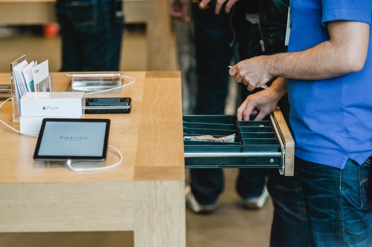 Apple store cashier with cash