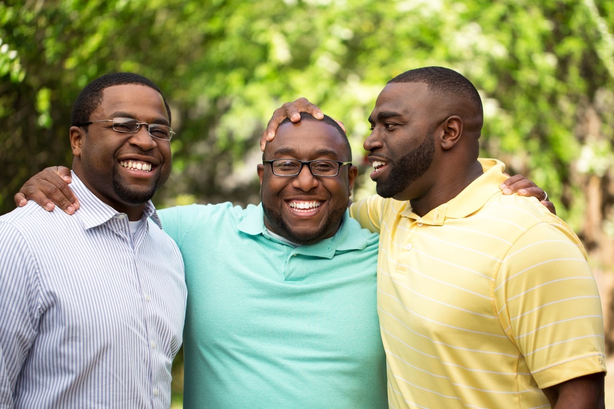 Brothers handing out laughing and talking