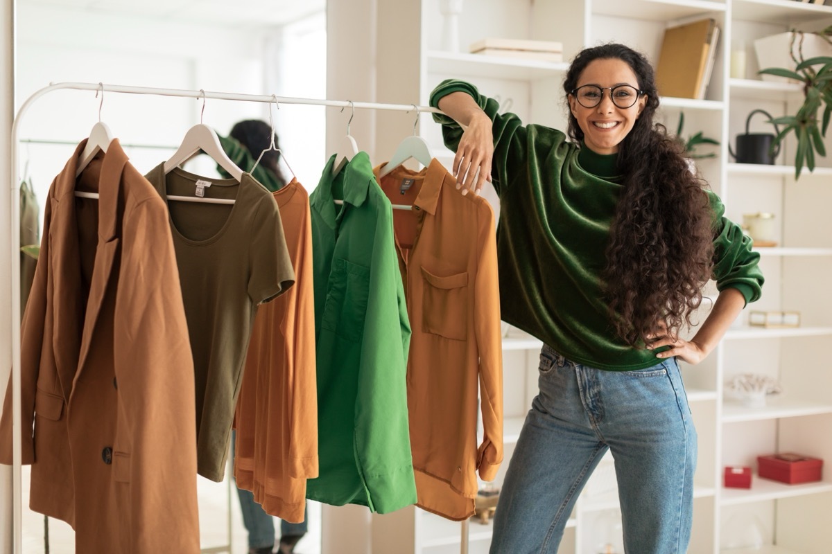 Woman Next to Clothing Rack