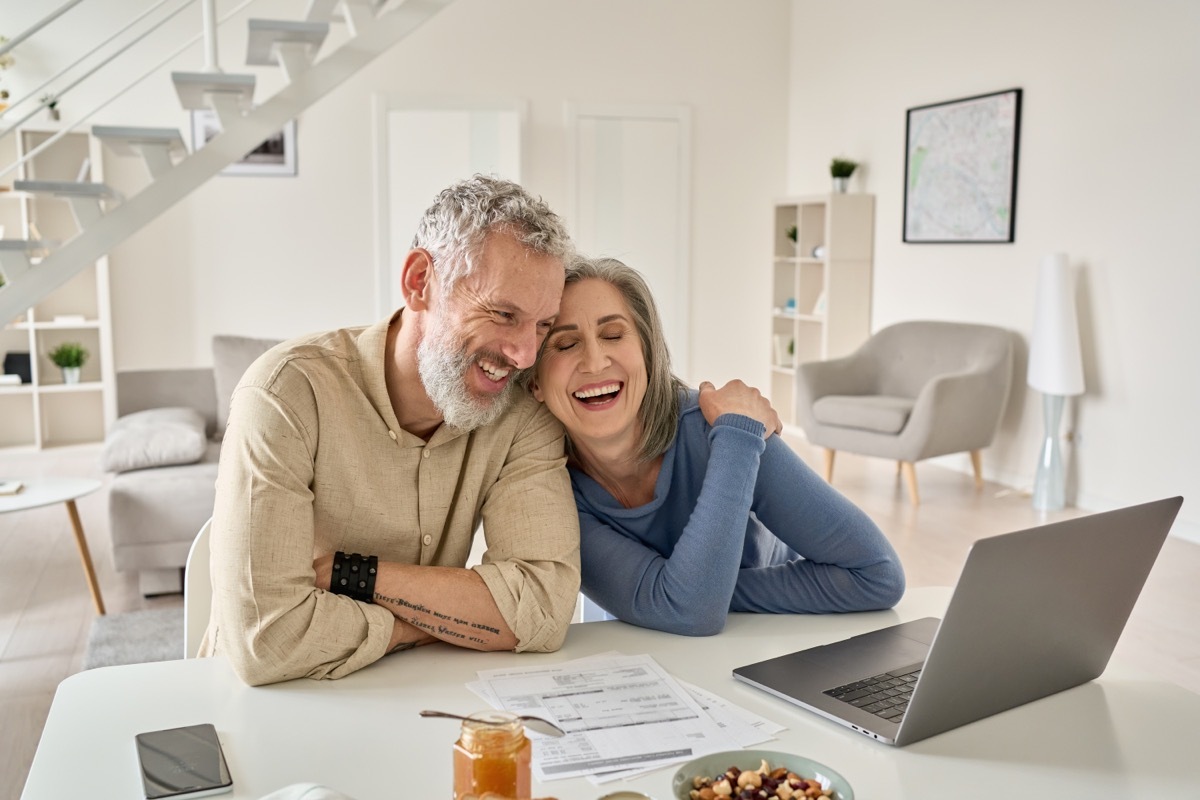 Happy Older Couple Using Laptop