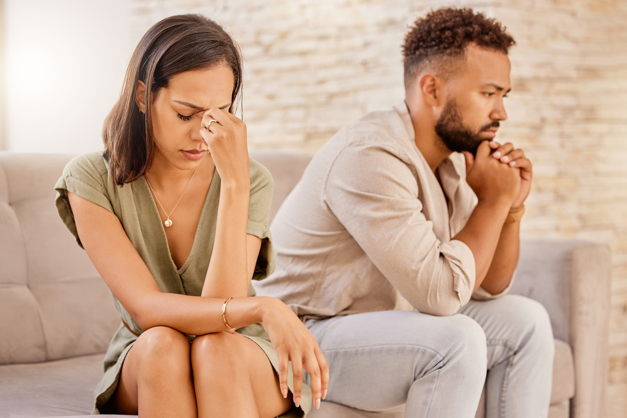 Fight, divorce and depression with couple on sofa for conflict, therapy and mental health or marriage counseling. Sad, anxiety and stress with man and woman in living room for fail, crisis and angry