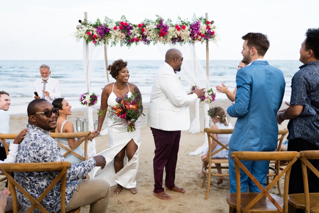 beach wedding bride and groom this is the age most people get married in every US state