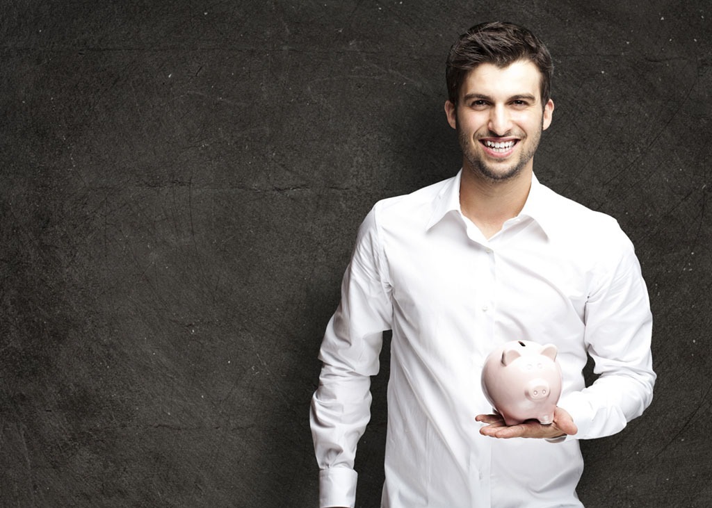 man with piggy bank saving money 