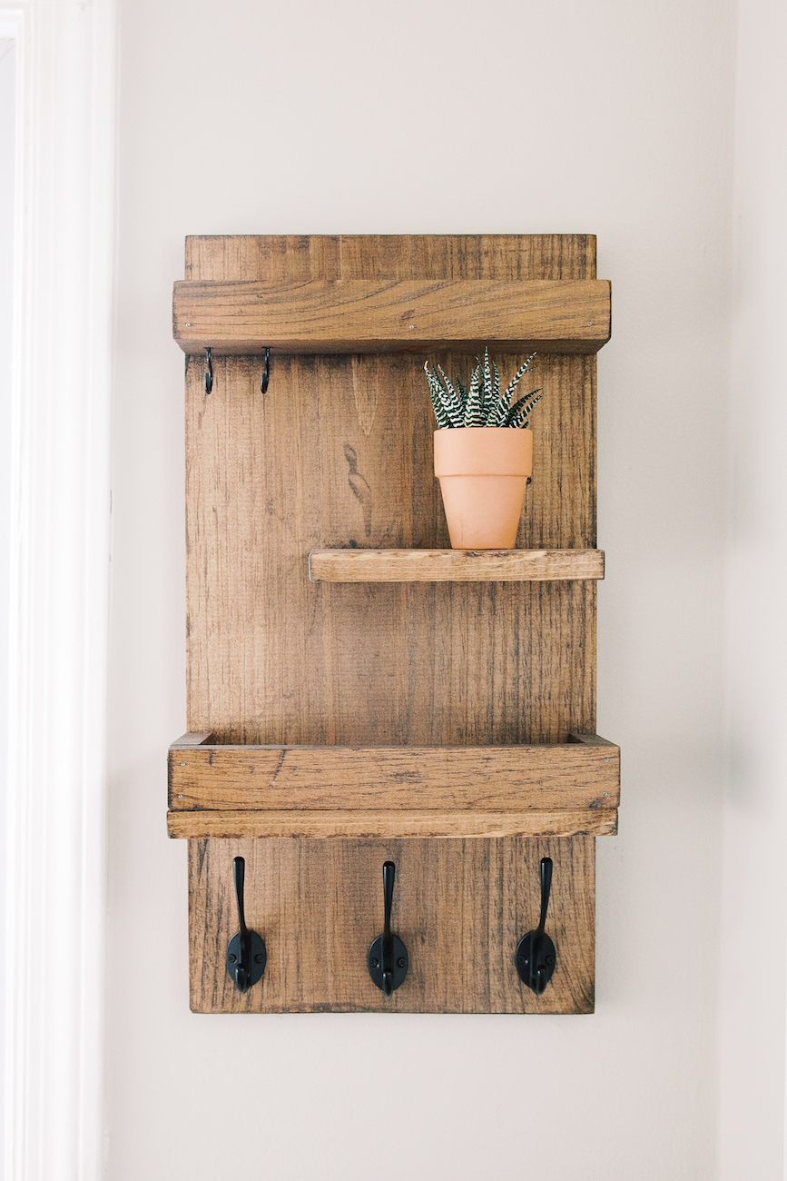 wooden entryway organizer with succulent