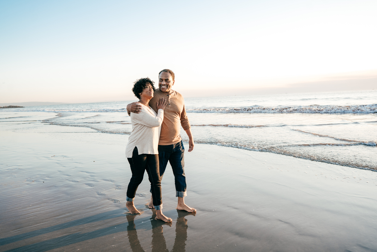 retired couple on beach