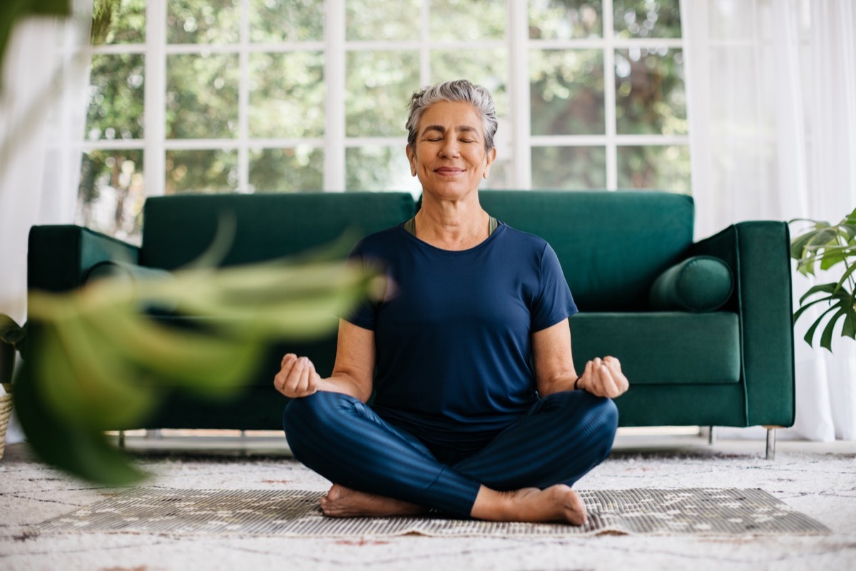 woman sitting in lotus position