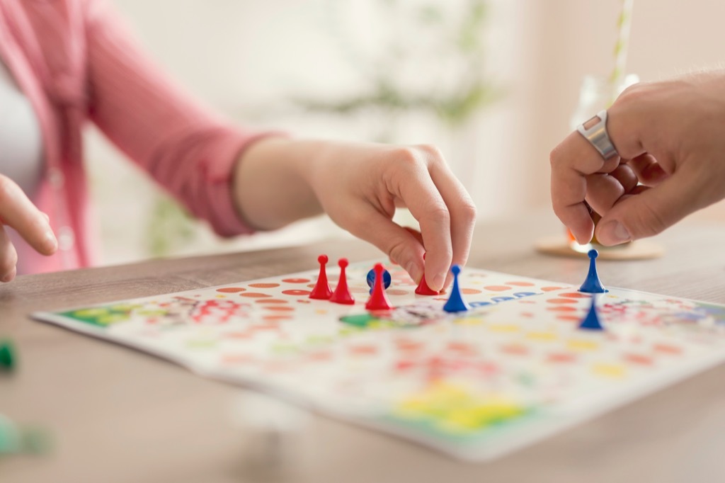 playing a board game is an easy way for couples to relax