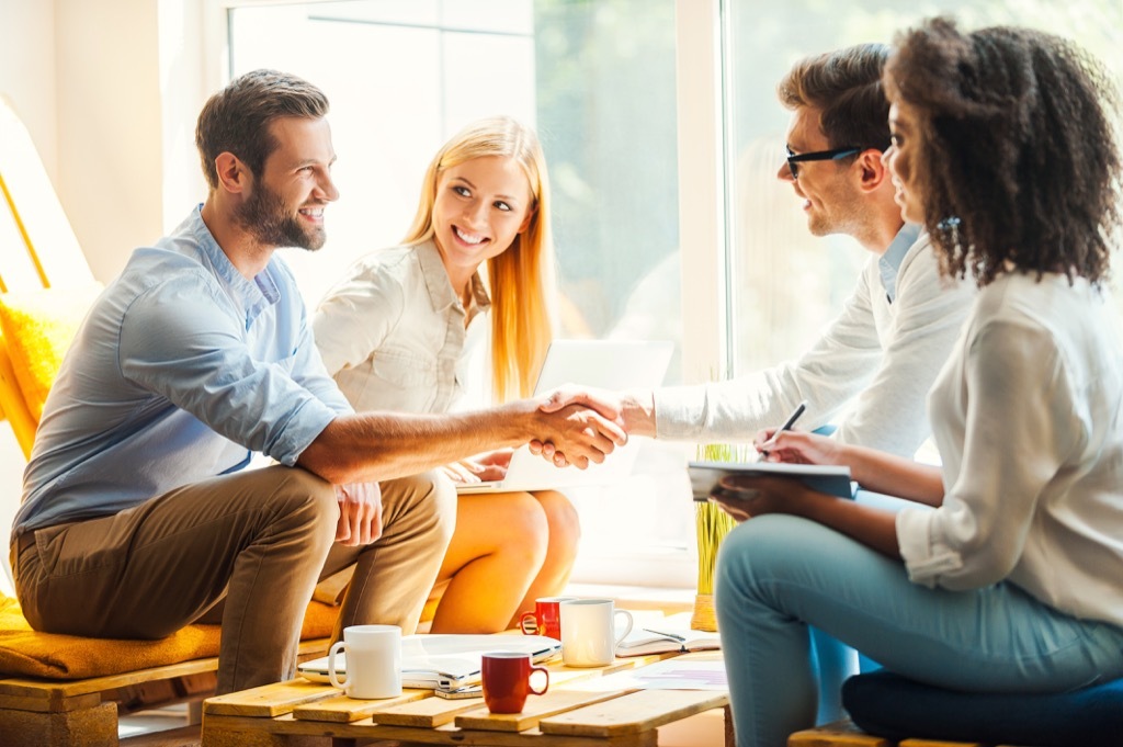 coworkers first impression handshake greeting