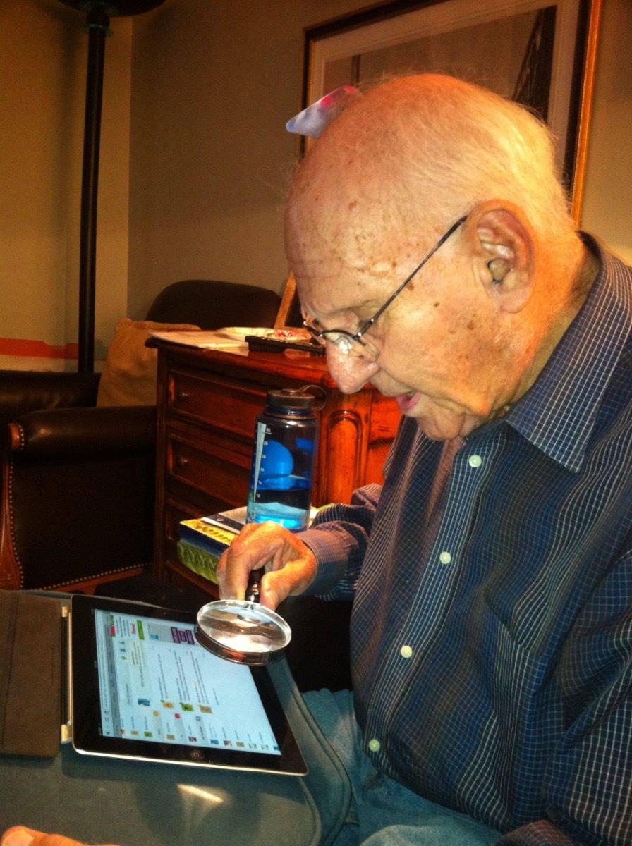 Grandpa Looking at His iPad With a Magnifying Glass Grandparents Failing at Technology