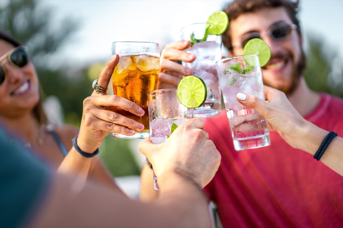 Group of friends toasting with cocktails