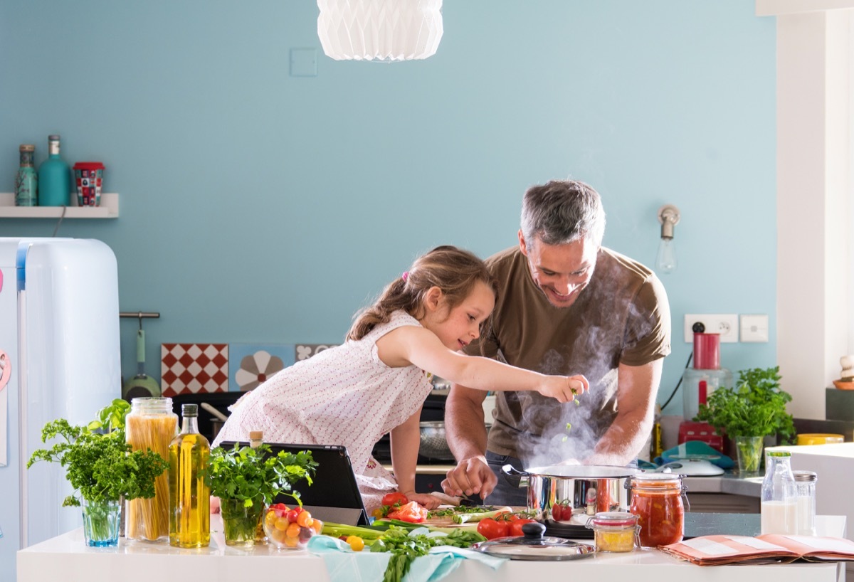 Father and daughter cooking