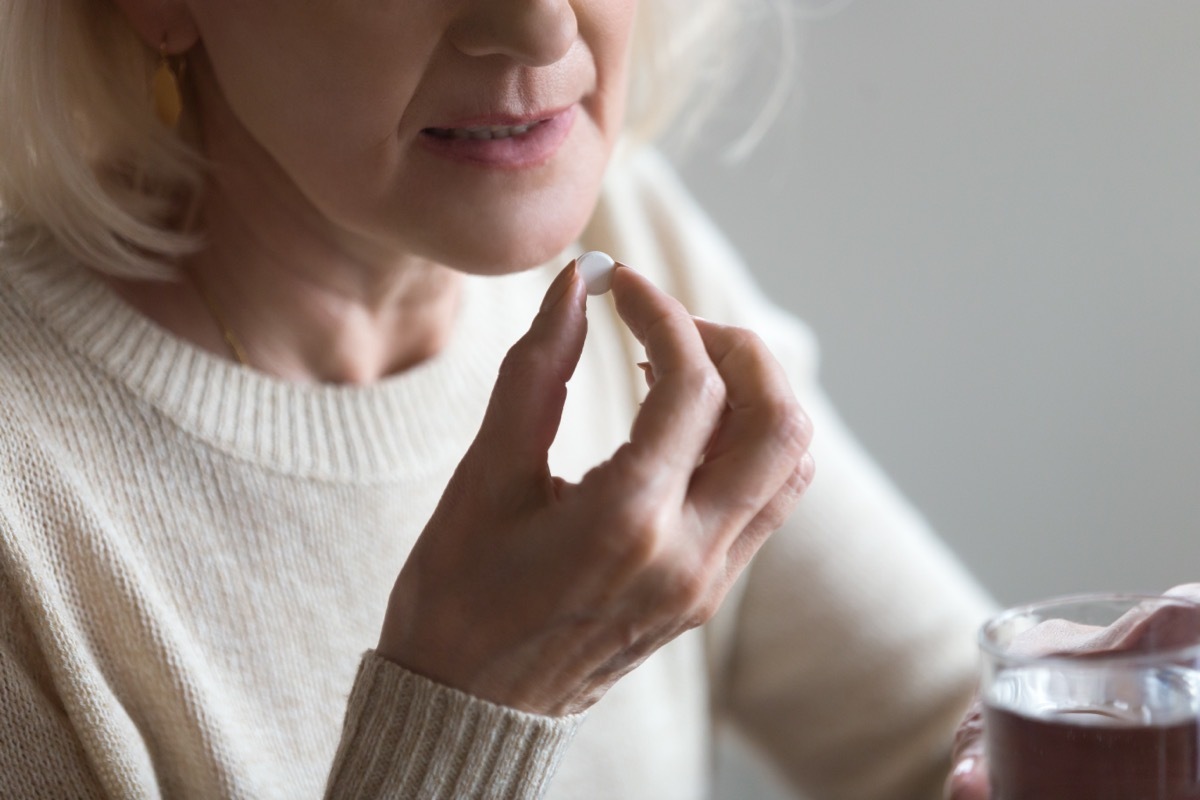 Older Woman Taking Aspirin