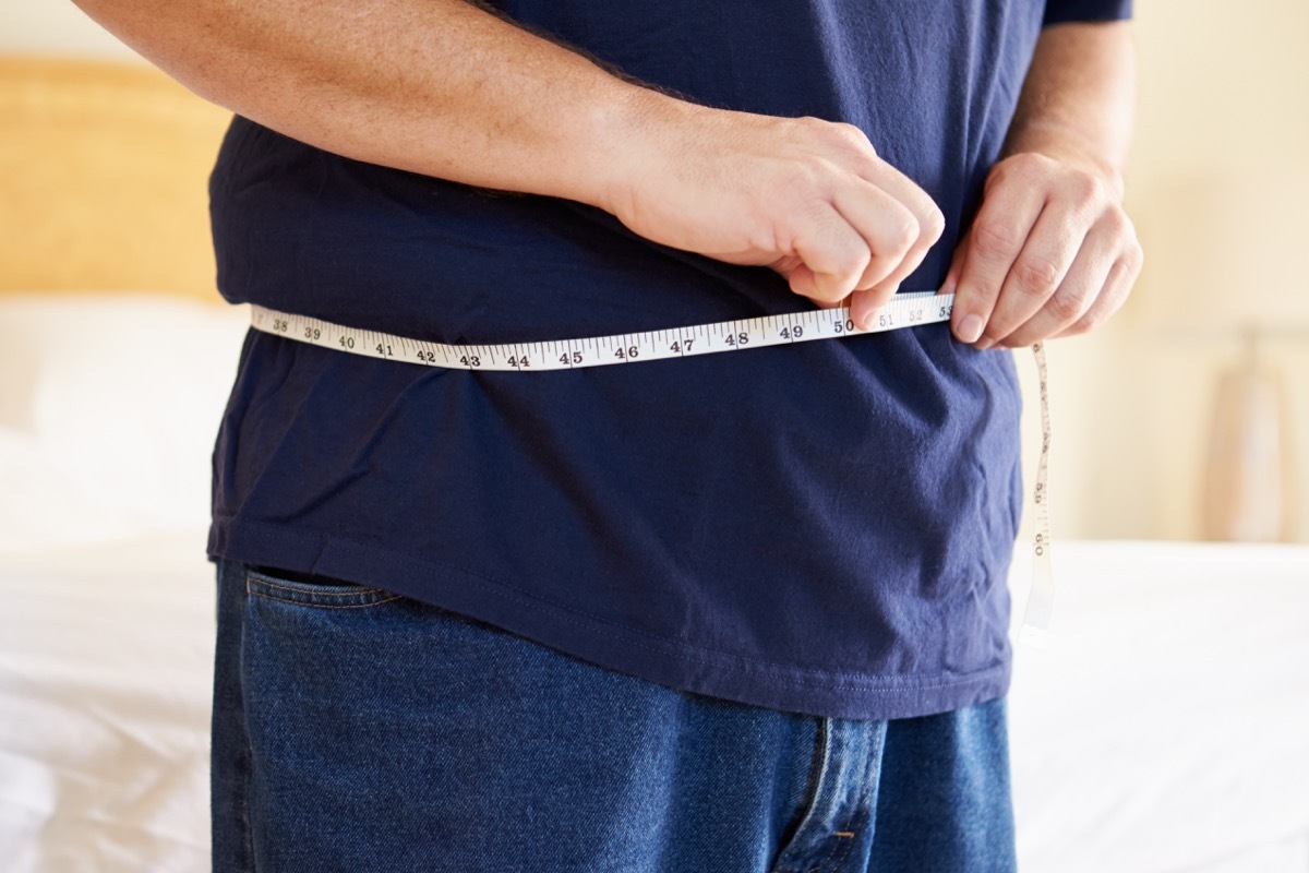 man checking his stomach size