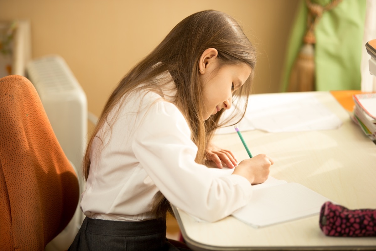 white child writing letter