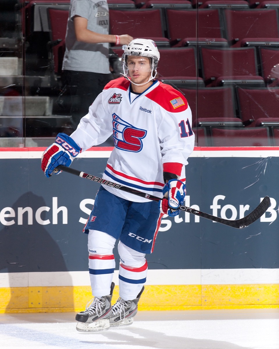 Liam Stewart skating in hockey uniform