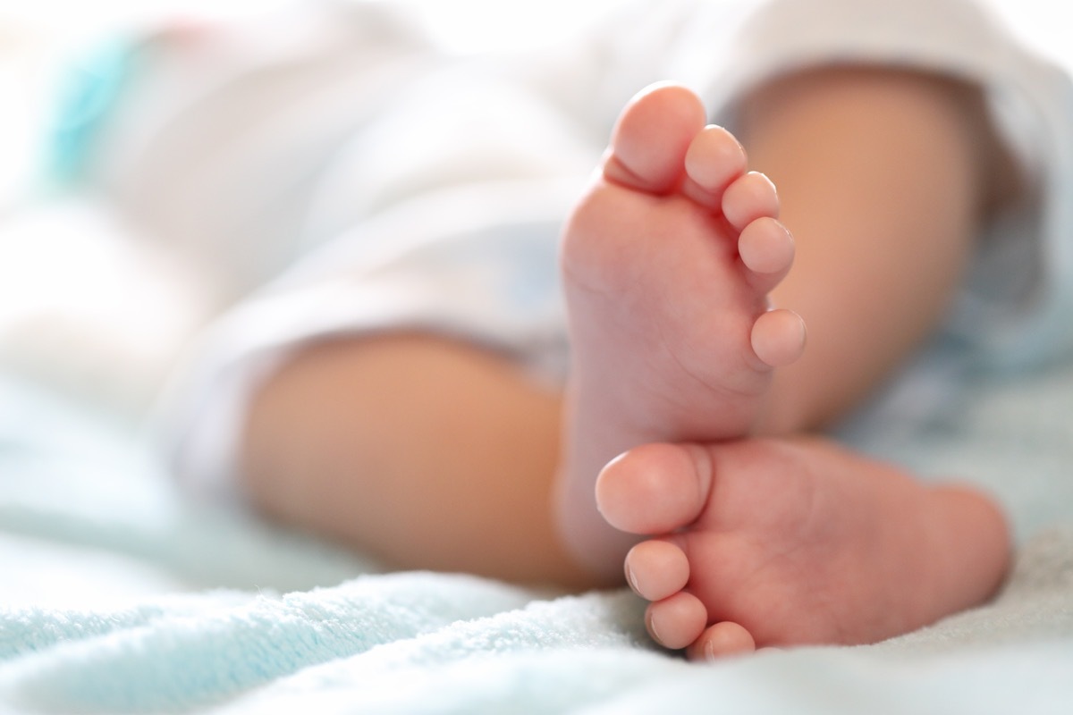 A close-up of tiny baby feet