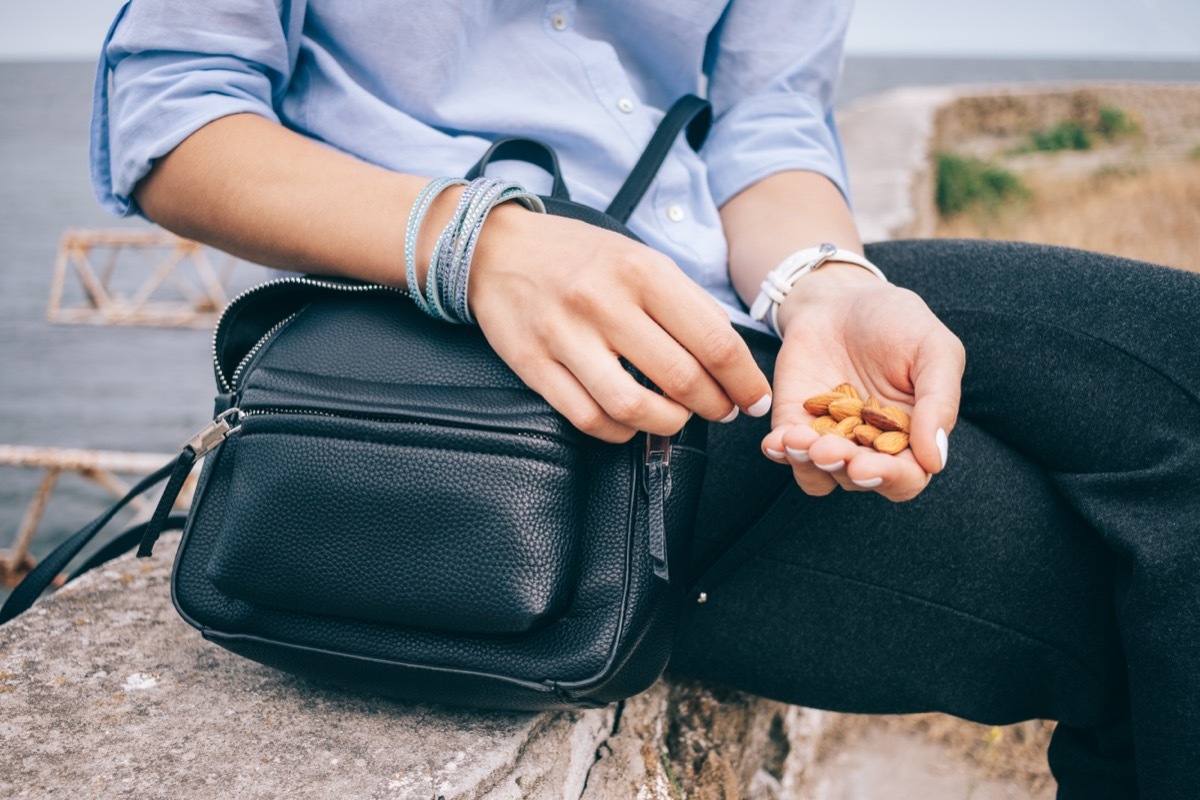 Person Eating Almonds