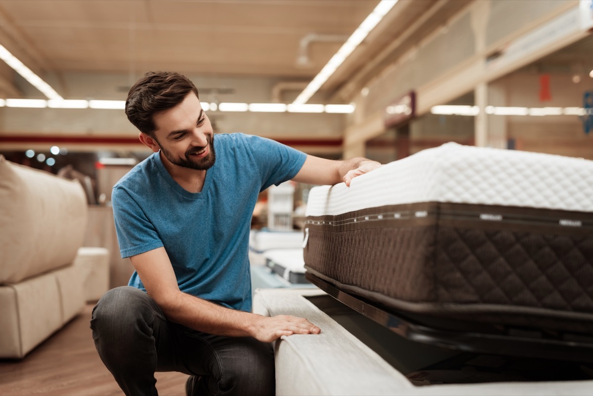 Man Inspecting a Mattress While Shopping, https://bestlifeonline.com/body-sleep/