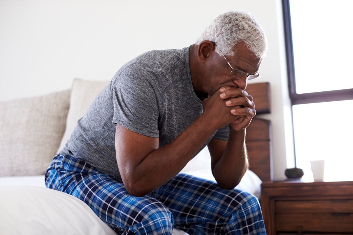 sad, depressed, or tired man in his bed, health questions after 40