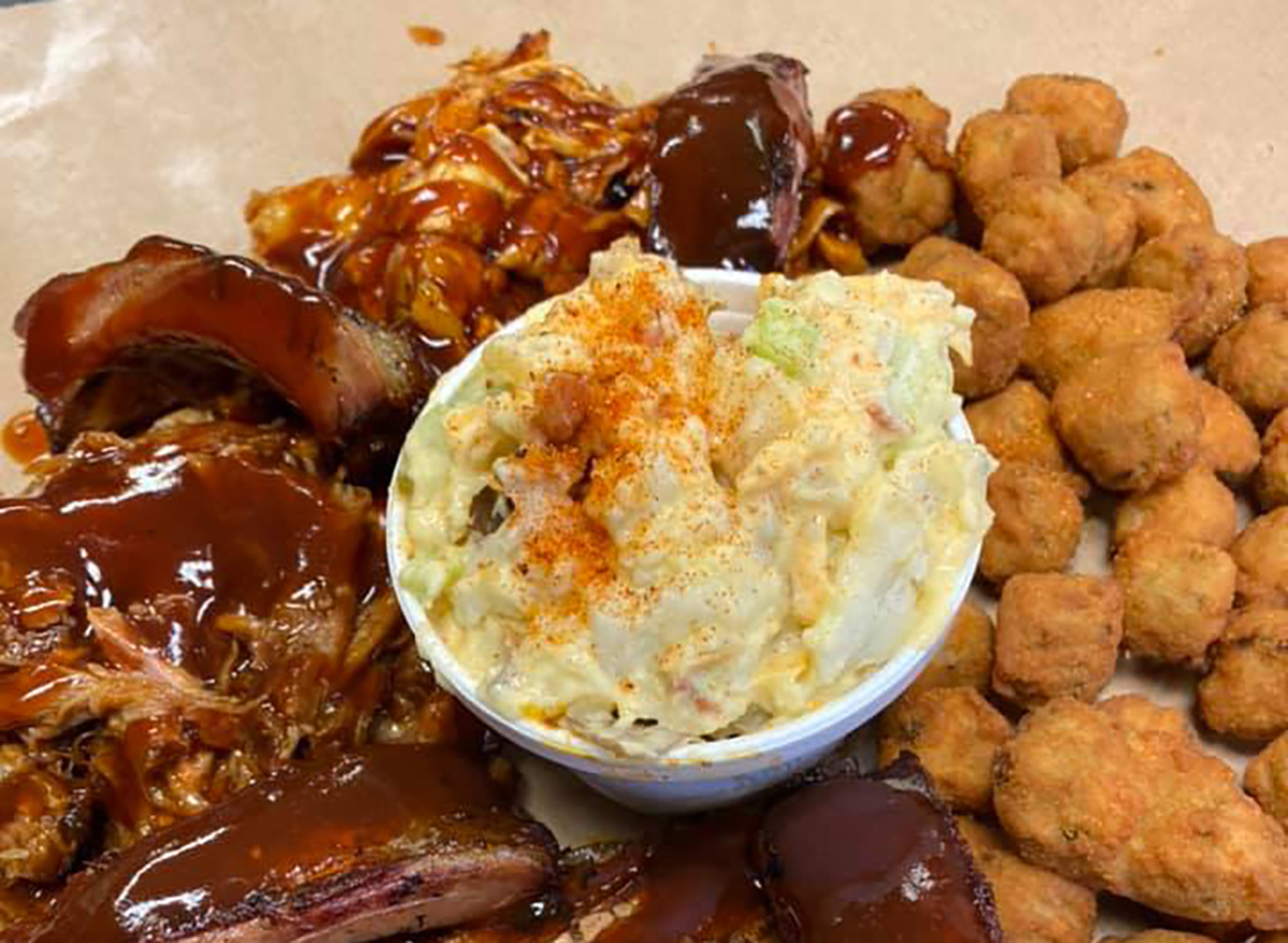 plate of ribs and brisket with potato salad