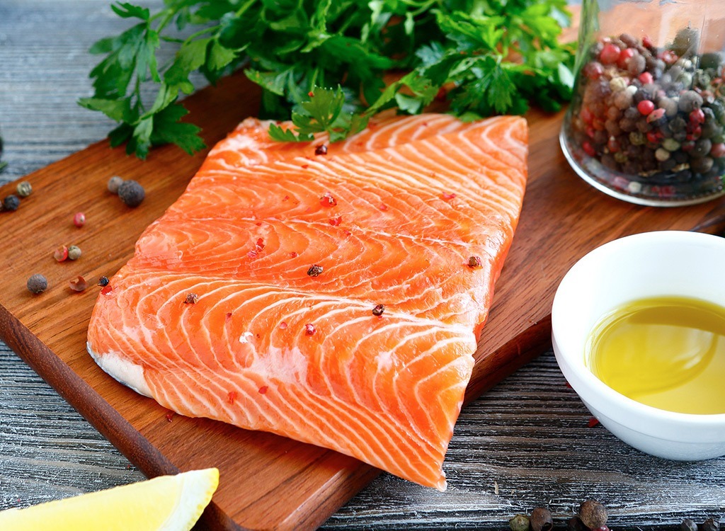 raw salmon on cutting board