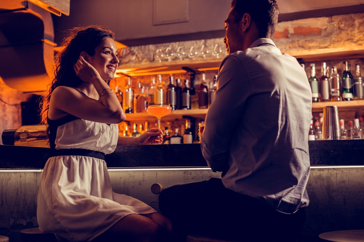 Happy girlfriend. Happy girlfriend wearing white dress feeling relaxed spending time with her man