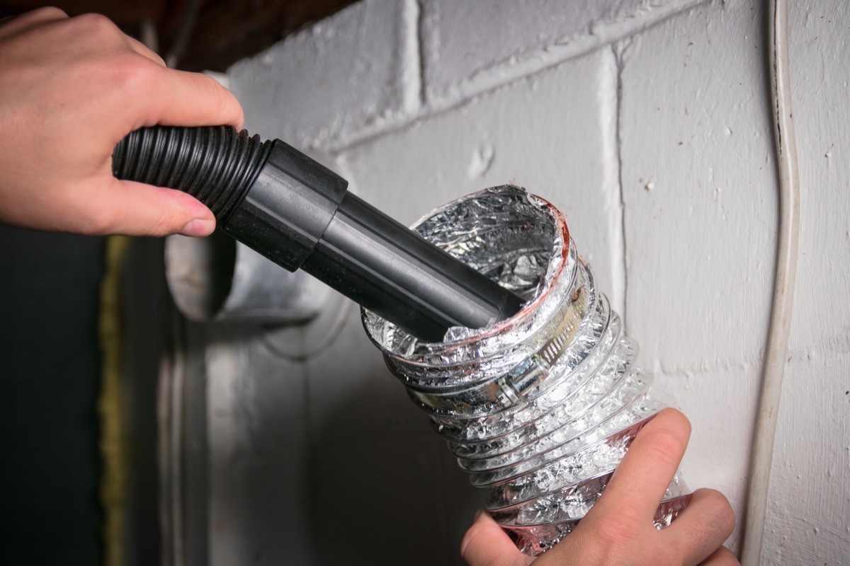 Man Cleaning Out the Dryer Ducts Home Improvement Projects