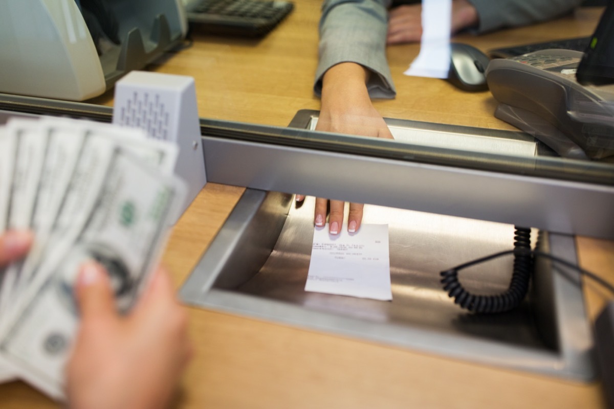 white person cashing check at bank