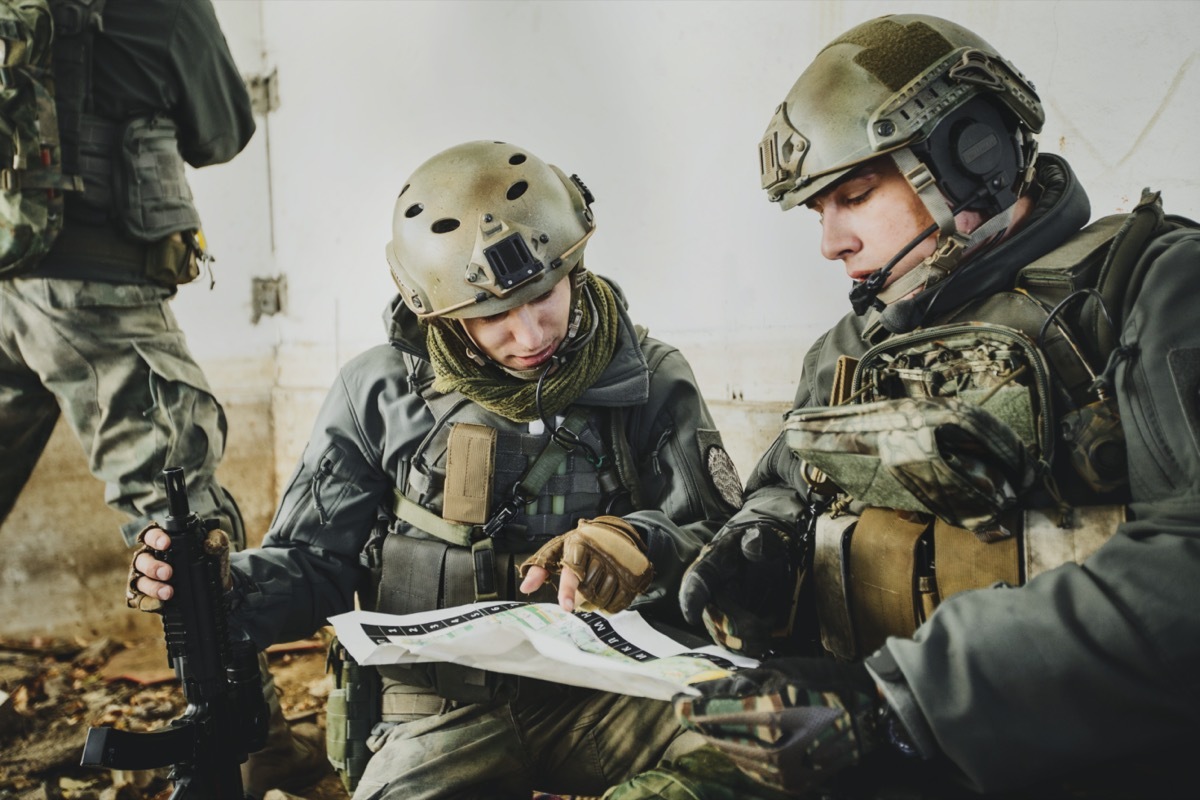 two military men going over a plan