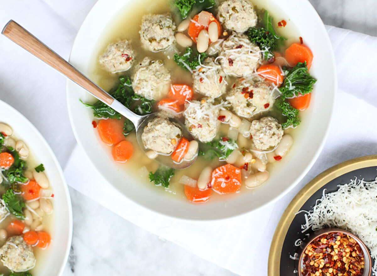 bowl of turkey meatball soup with kale and carrots