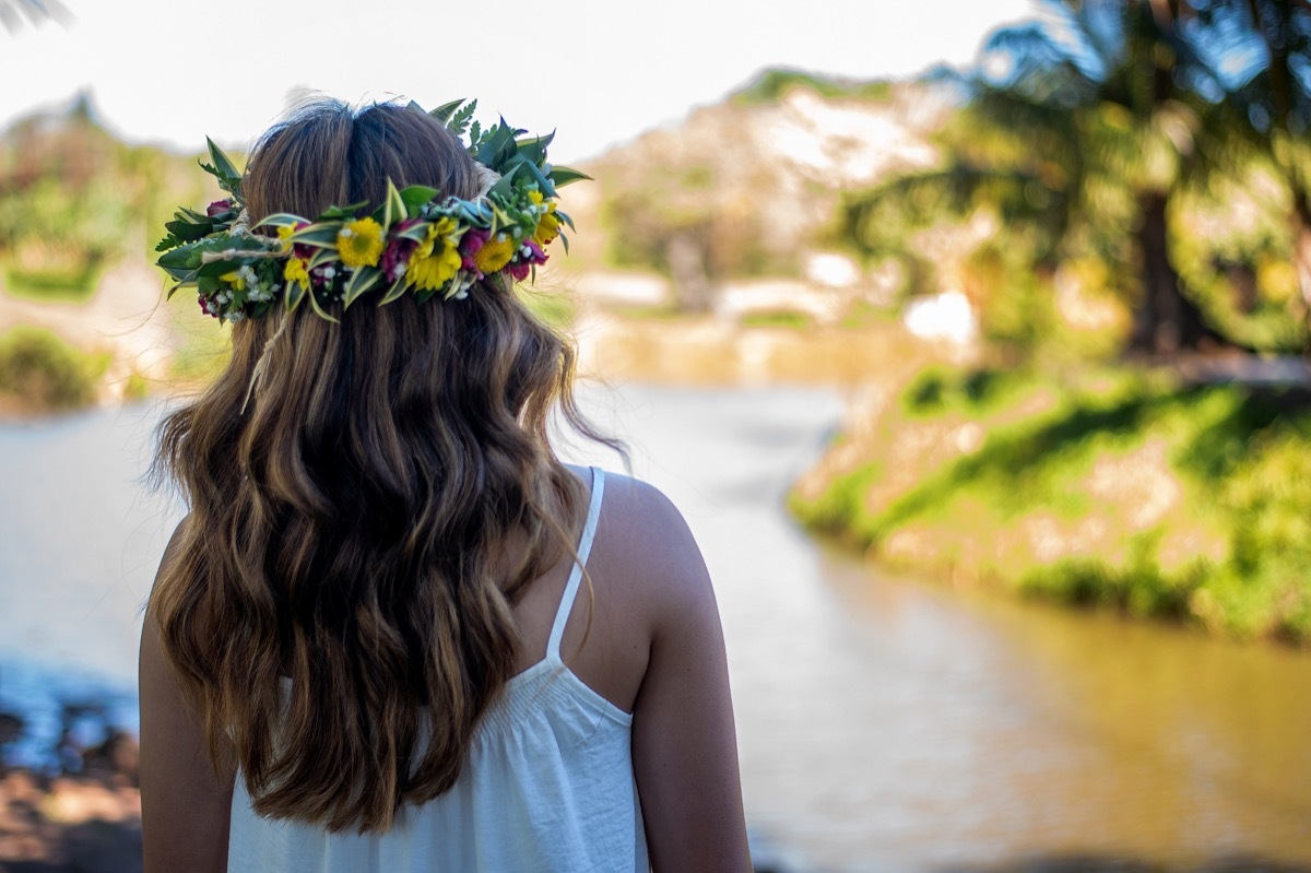 woman wearing a haku lei in her hair