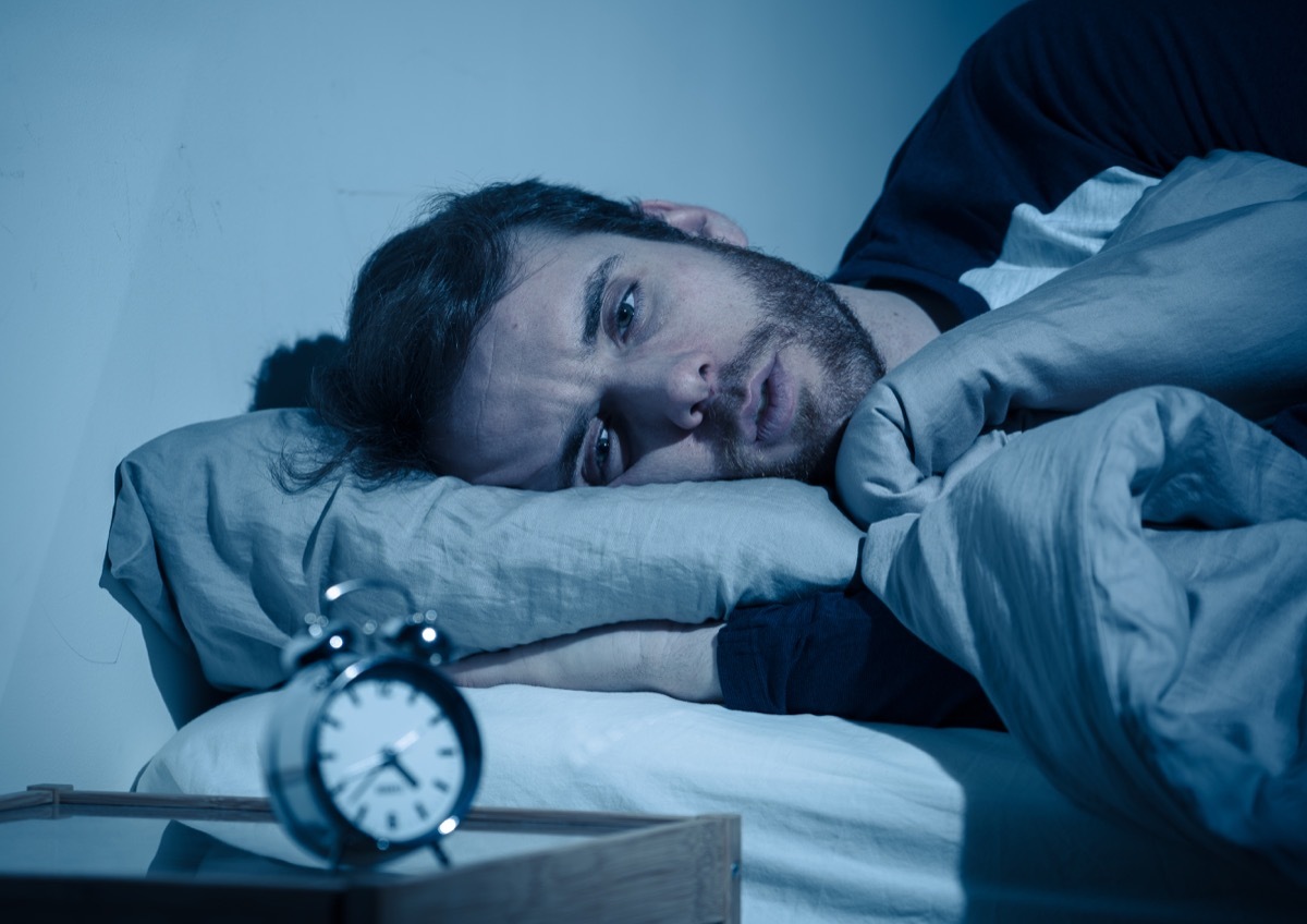 Man struggling to fall asleep and stay asleep