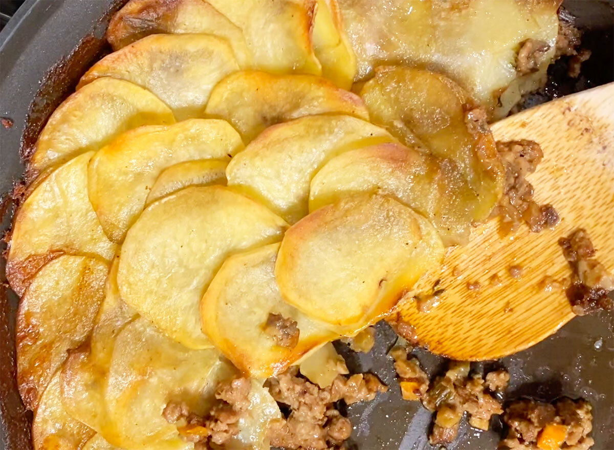 whole30 shepherds pie with potato slices and ground beef in a pan