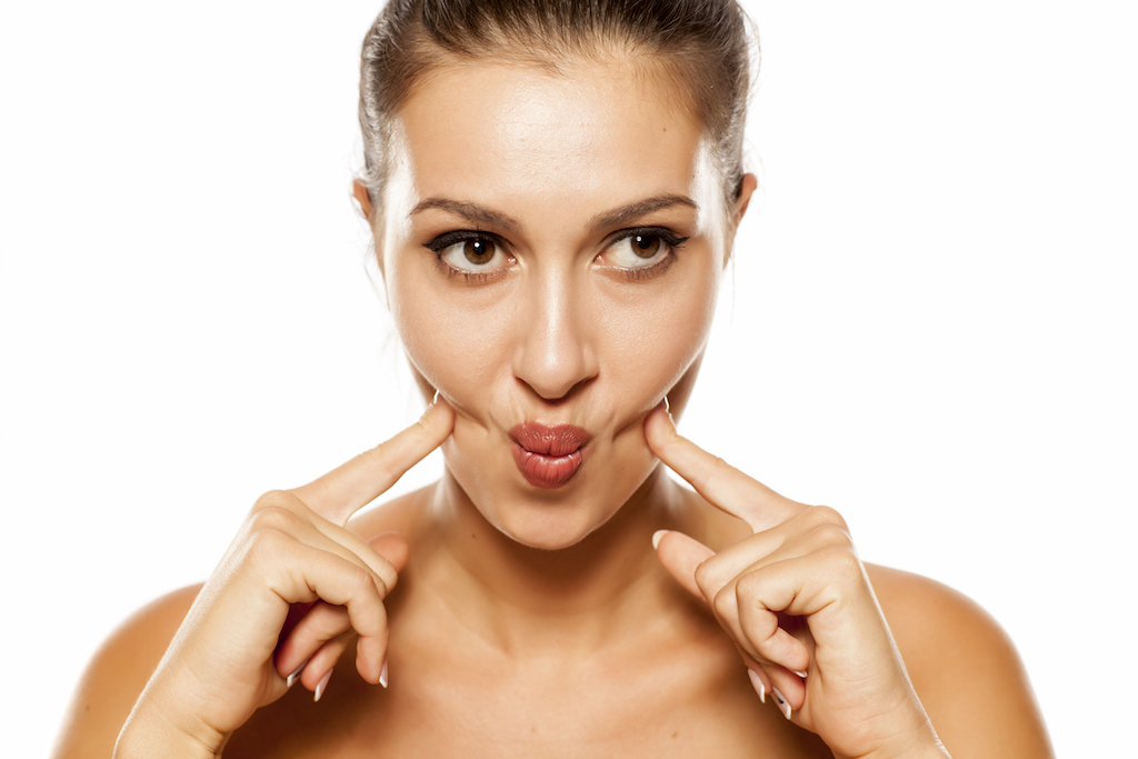 Woman Doing Facial Exercise Anti-Aging Tips You Should Forget