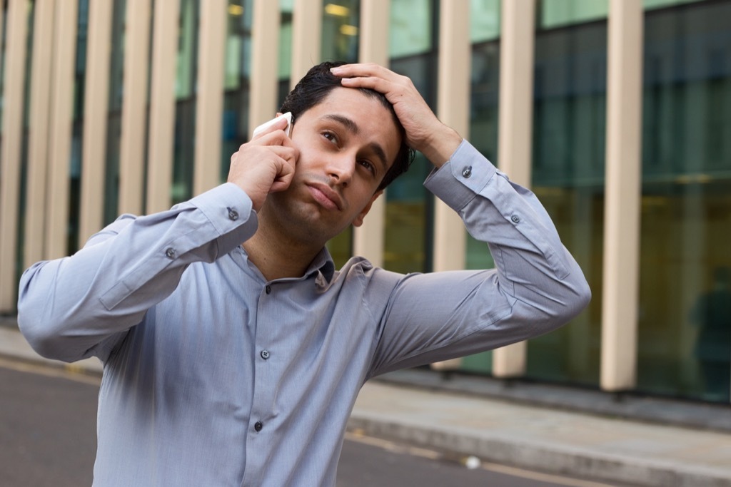 man on phone fighting long-distance relationships