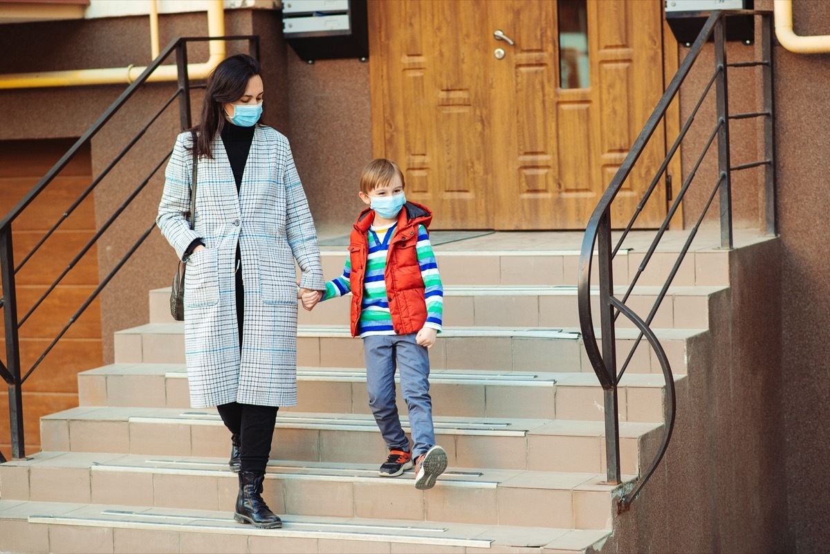 Mother and son going for a walk with masks on