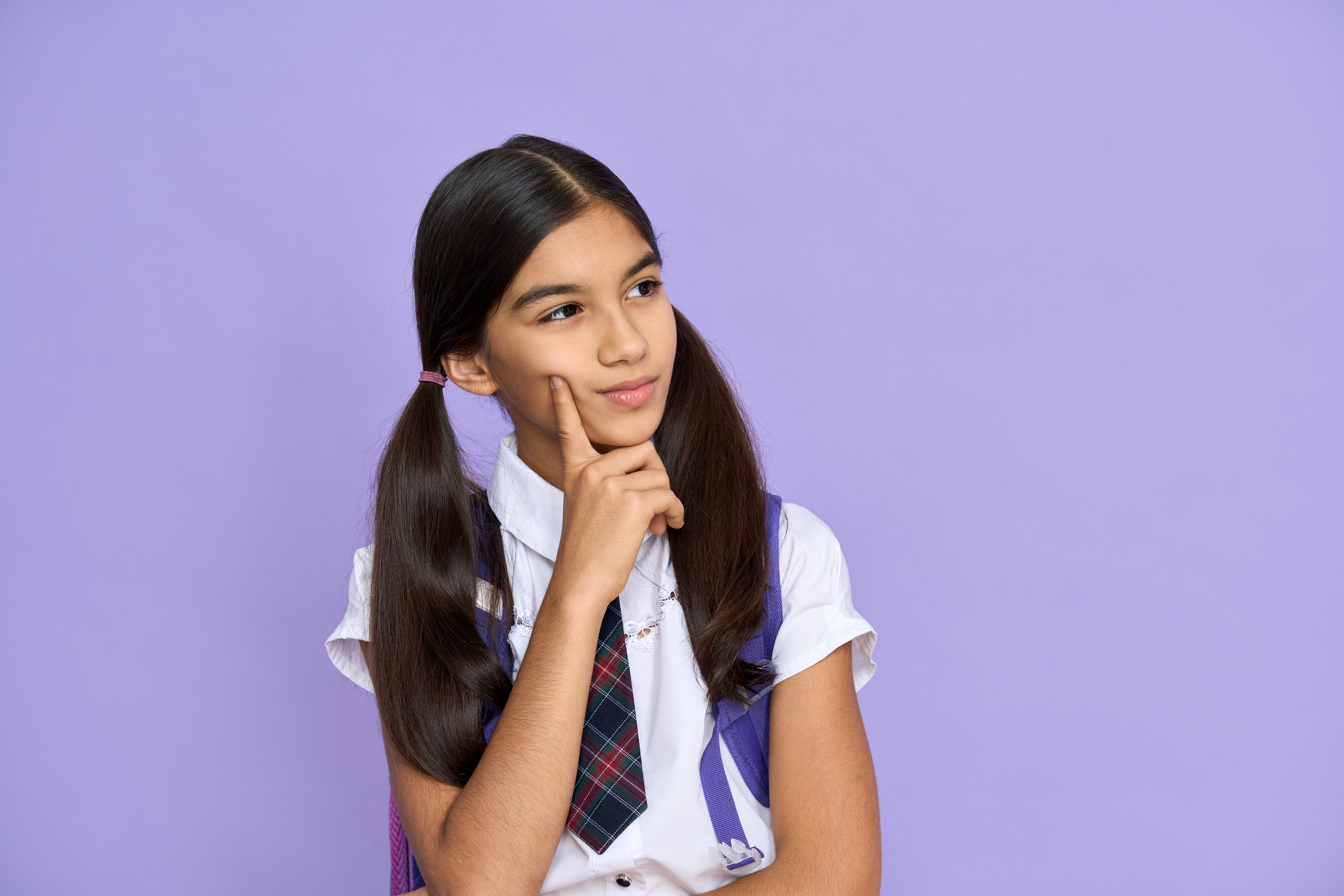 young school girl looking stumped