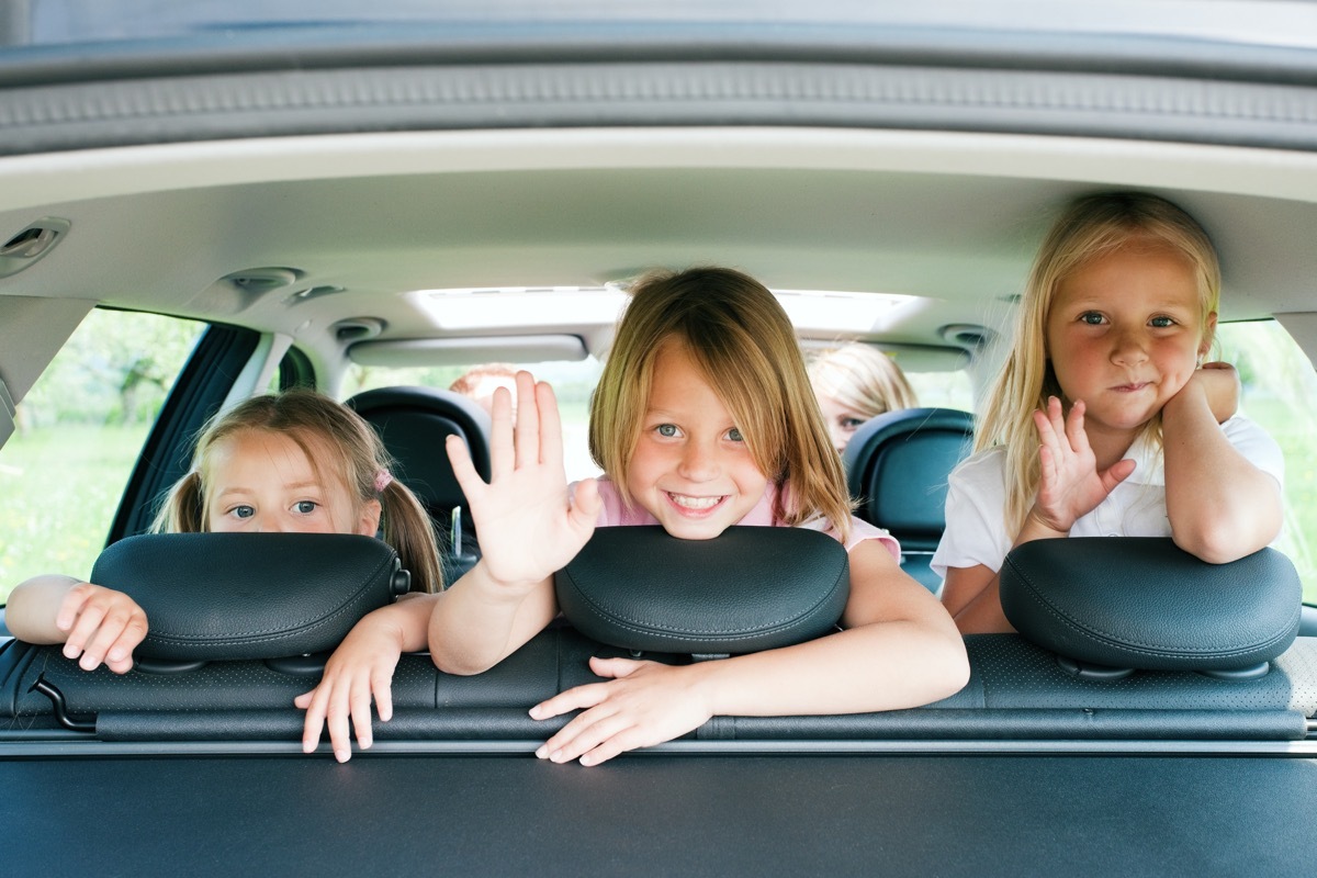 three siblings in a car together, middle child