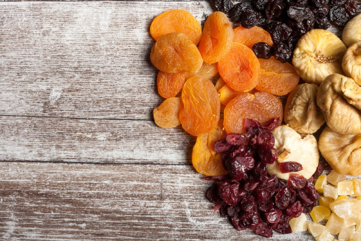 dried fruit and nuts on wood