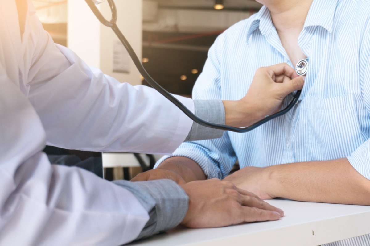 Doctor checks the patient's chest.