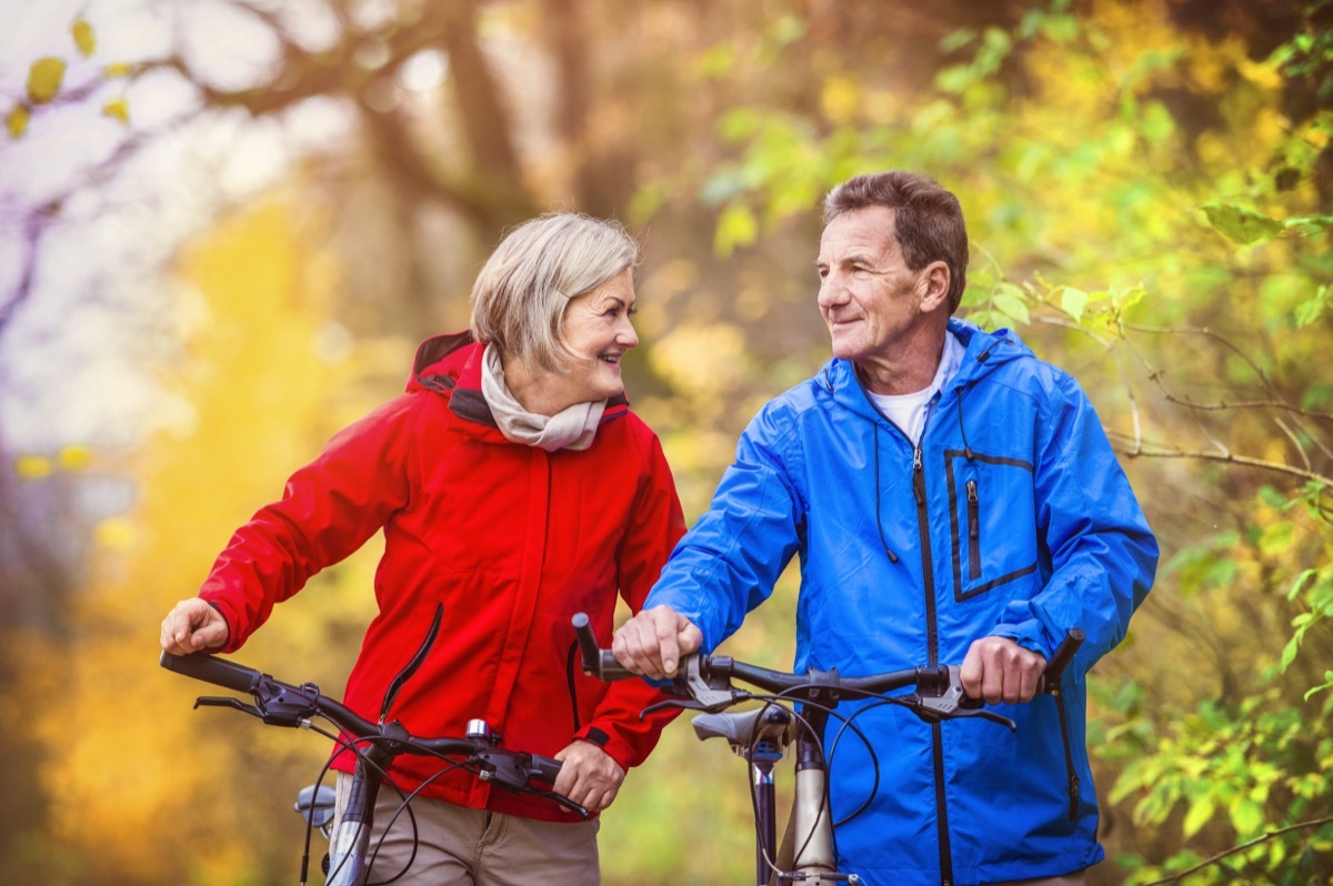 older couple on bikes sharing positive affirmations