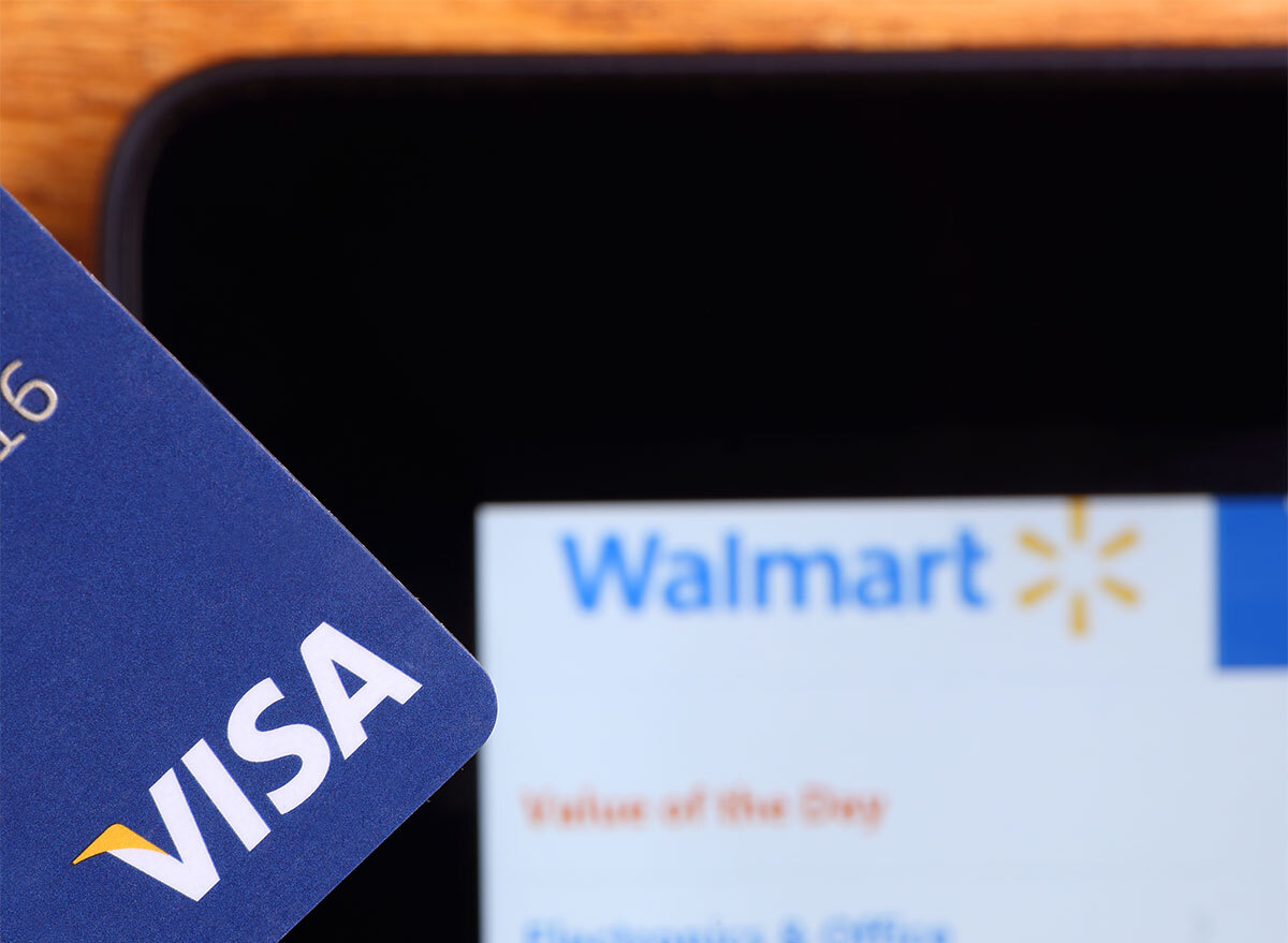 walmart website on smartphone with visa credit card