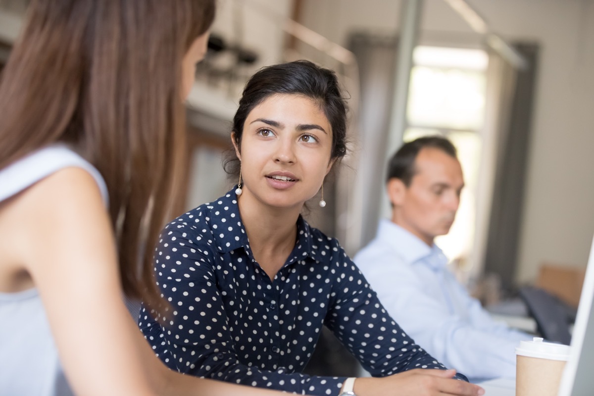 woman with shocked expression talking to another woman