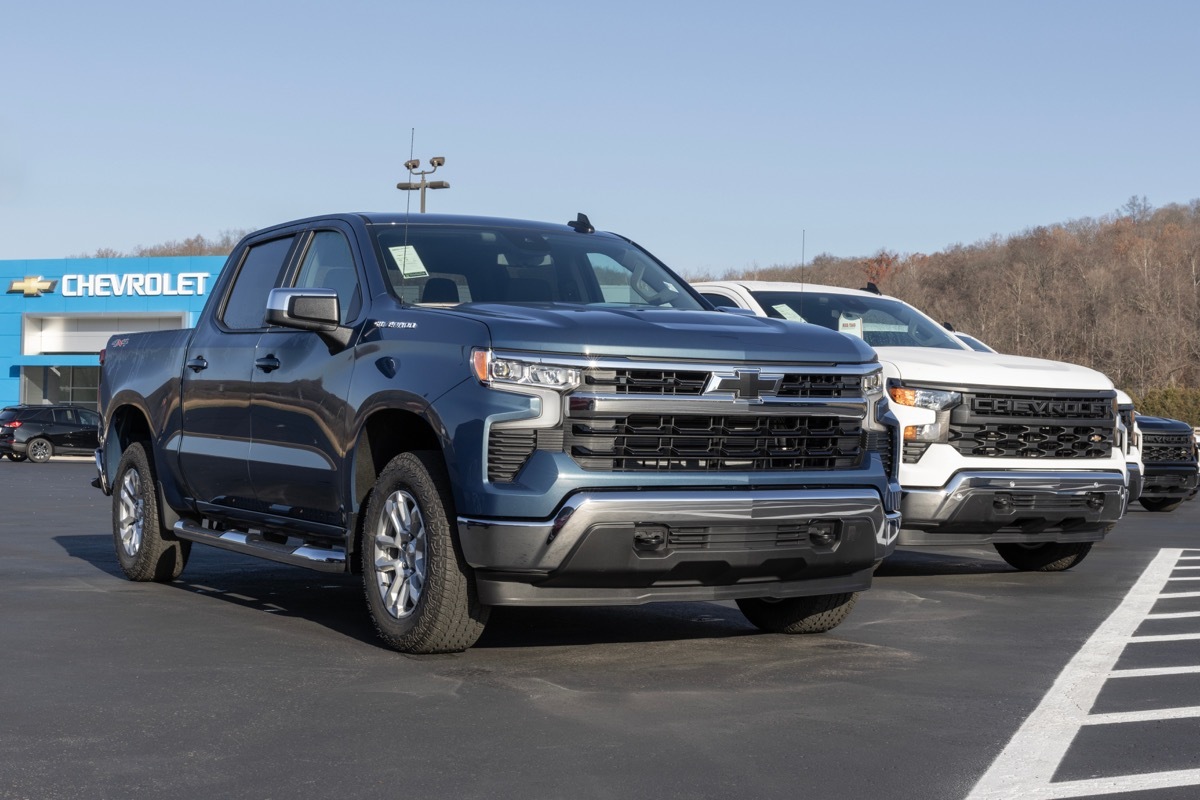 Chevrolet Silverado 1500 display at a dealership. Chevy offers the Silverado in WT, Trail Boss, LT, RST, and Custom models.